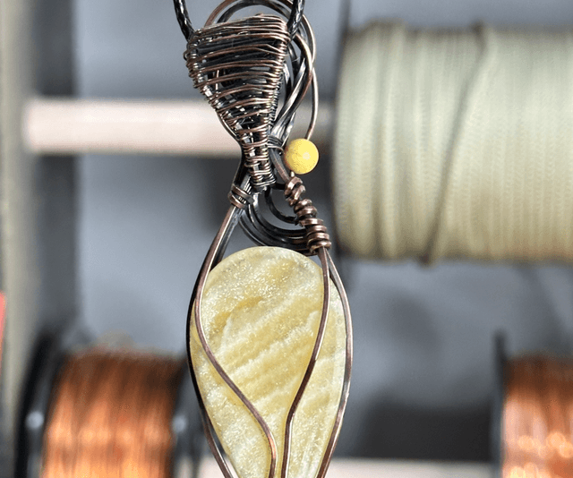 Orange Calcite pure copper wrapped pendant 