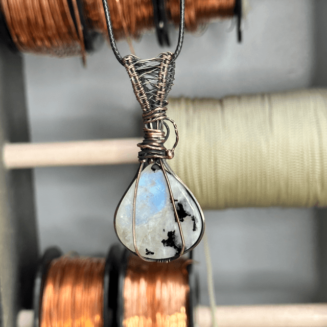 Rainbow moonstone wrapped in pure copper pendant 