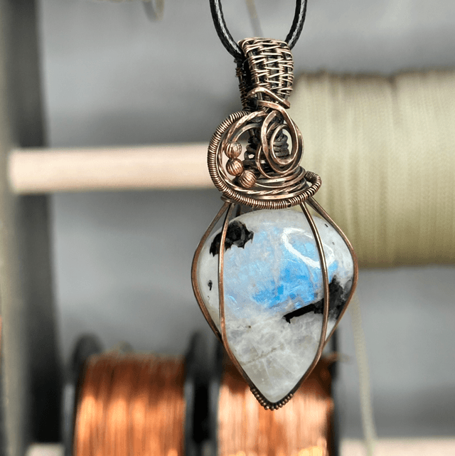 Rainbow moonstone wrapped in pure copper pendant 