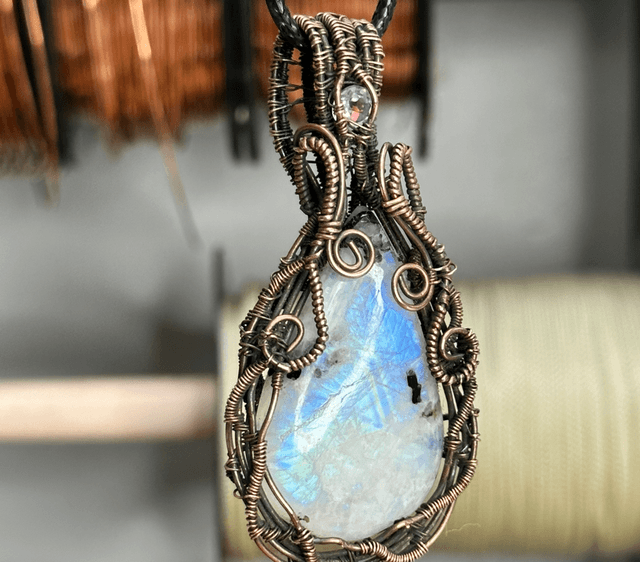 Rainbow moonstone wrapped in pure copper pendant 