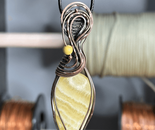 Orange Calcite pure copper wrapped pendant 